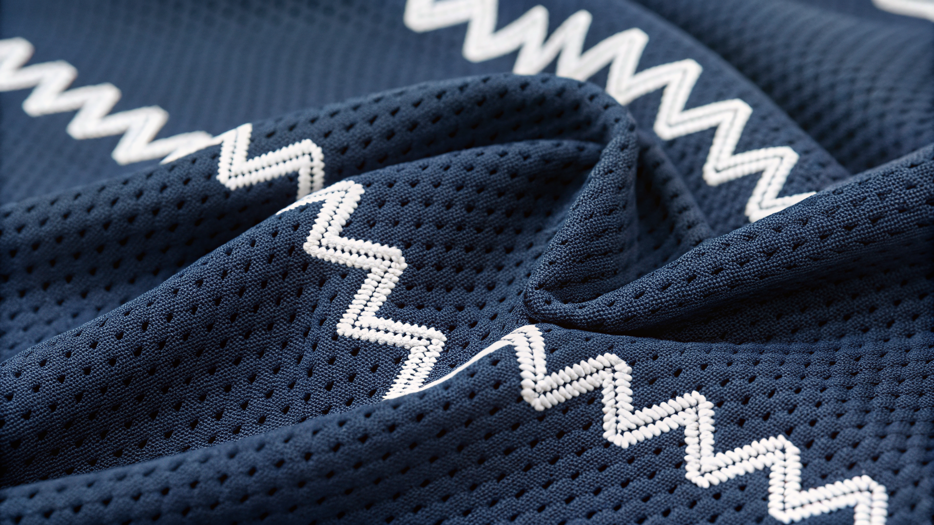 Three-Step Zigzag close-up on navy sportswear fabric