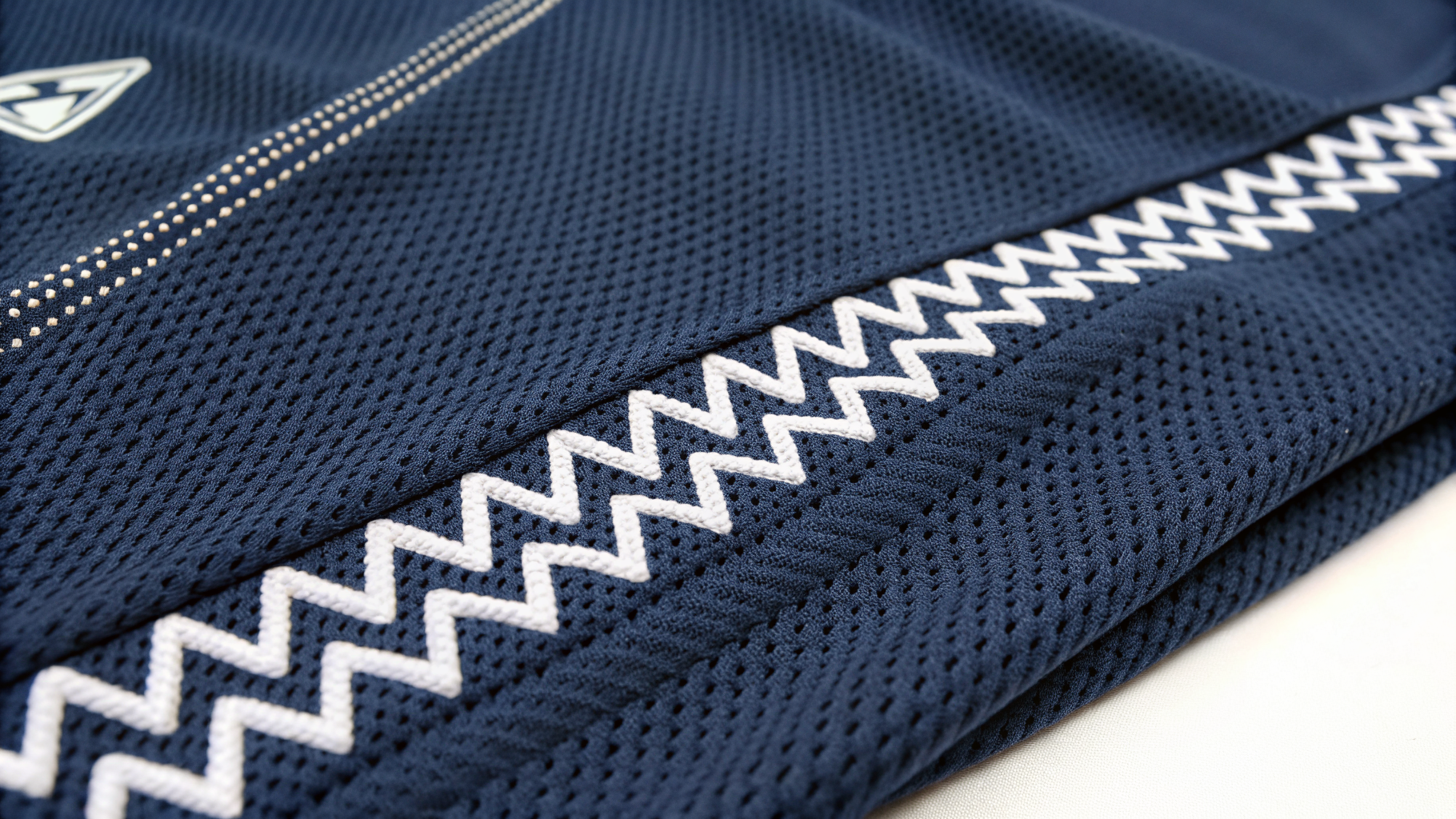 Zigzag Stitch close-up on navy sportswear fabric